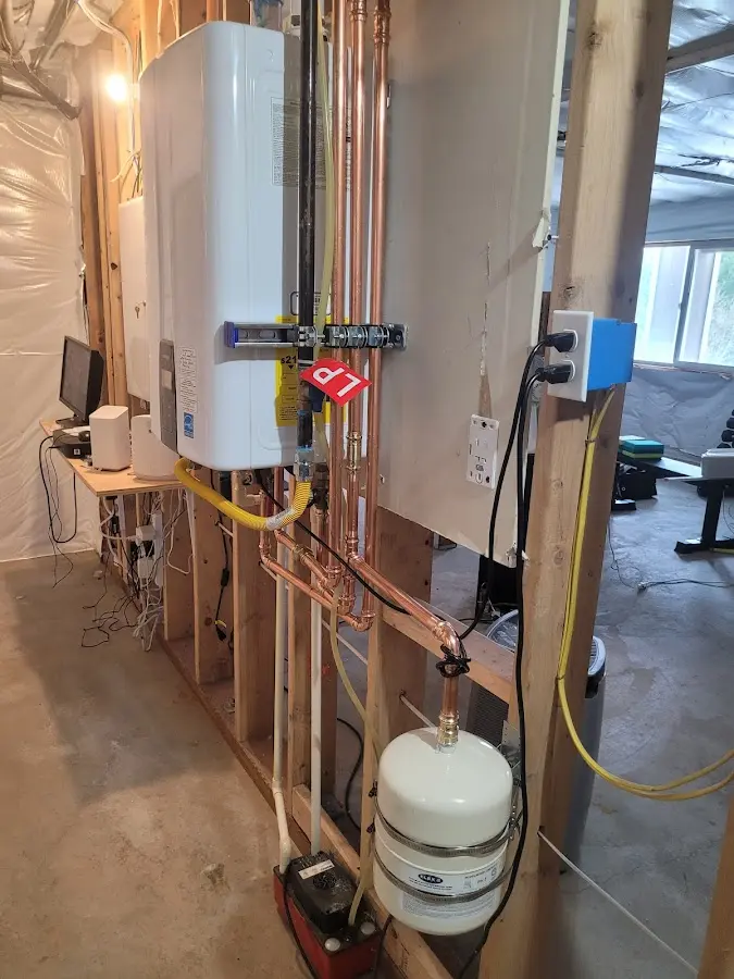 Licensed plumber repairing a kitchen sink in Neptune City